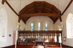 Lamarsh - Holy Innocents - Interior  The chancel of Holy Innocents was constructed around the same time as the nave - in 1140, but was rebuilt in the 14th century. Early 16th century brickwork framing the entrance to the rood stairs and rood loft is plainly visible. The delicate oak screen of 10 bays, erected in the 15th century, was a beautiful embellishment installed when Margaret Beaufort, the mother of Henry VII, was Lady of the Manor. : Church, Essex, Lamarsh, Holy Innocents, Grade 1, Round Tower, Norman, C12, Interior