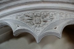 Little Leighs - St John: Sun Spandrell  This beautifully carved spandrel shows the Sun, with spreading flames, which is representative of God in many religions, especially early Celtic Christianity. For example, many early Christian symbols which contain IHS within the symbol of a flaming sun. The church is orientated to the east - where the rising sun is symbolic of Christ's return. : Church, Essex, Little, Leighs, Norman, C13, Monument